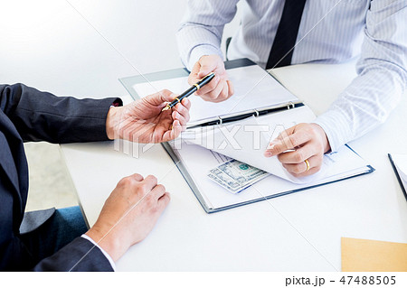 Businessman receive money in the envelope offered in file taking 47488505