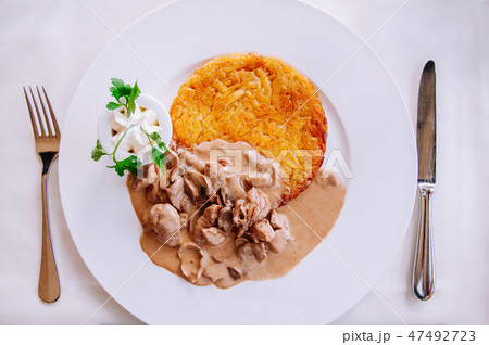 Zurich style veal stew and Rosti, Swiss cuisine 47492723
