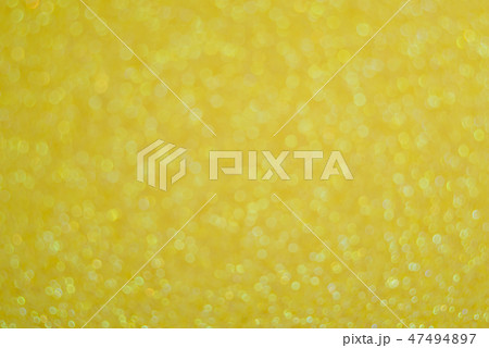 Abstract glitter yellow background 47494897