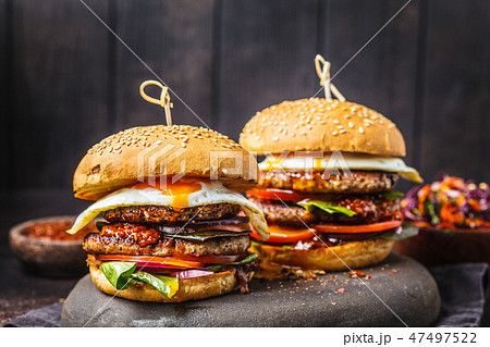 Homemade meat burgers with egg, sauce Homemade meat burgers with egg, sauce 47497522