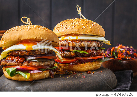 Homemade pork burgers with egg, sauce Homemade pork burgers with egg, sauce 47497526