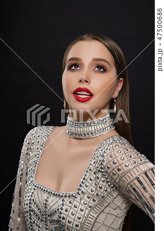 Elegant model posing in glam beaded dress. Elegant model posing in glam beaded dress. 47500686