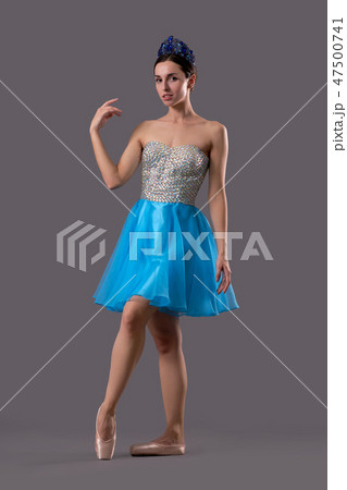 Front view of graceful ballerina looking at camera in studio Front view of graceful ballerina looking at camera in studio 47500741