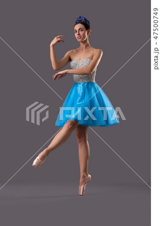 View from side of ballerina dancing on isolated background 47500749