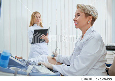 Women in hospital working to prevent illness. 47500899