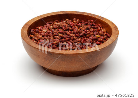 Dried sumac berries in wooden bowl 47501825