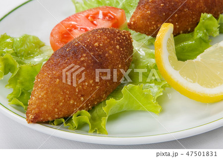 Turkish stuffed meatballs and lettuce leaves Turkish stuffed meatballs and lettuce leaves 47501831