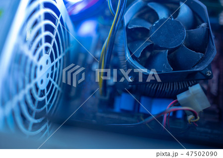 PC components in dust. macro CPU fan. It does not work, power unit fan grille, dust flies around PC components in dust. macro CPU fan. It does not work, power unit fan grille, dust flies around 47502090