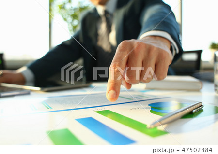 Hand of businessman in suit filling and signing with Hand of businessman in suit filling and signing with 47502884