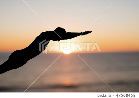 silhouette of a man throwing himself into the sea. silhouette of a man throwing himself into the sea. 47508458