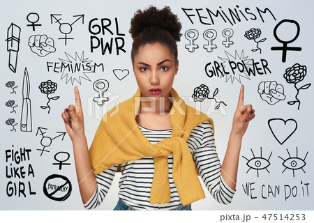 Young woman studio isolated in white pointing up with two hands Young woman studio isolated in white pointing up with two hands 47514253