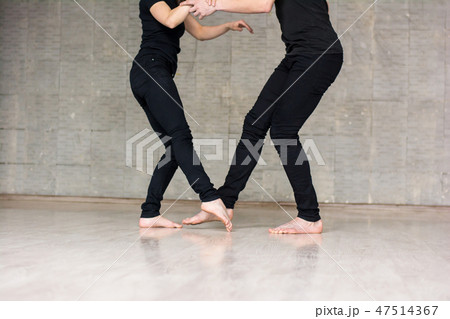 Young couple performing modern dance. 47514367