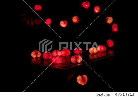Closeup heart shape of led lights in dark room 47514513