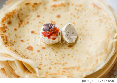 Labne cheese balls with spices on thin pancakes Labne cheese balls with spices on thin pancakes 47514856