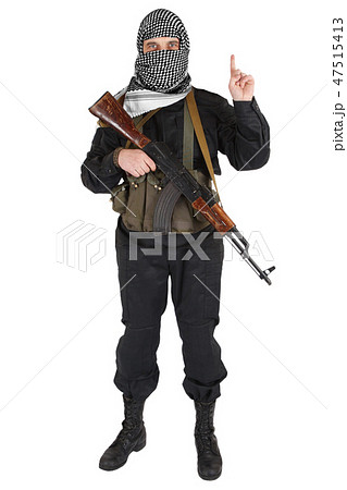 insurgent dressed in black uniform and black and white shemagh with AK 47 rifle insurgent dressed in black uniform and black and white shemagh with AK 47 rifle 47515413