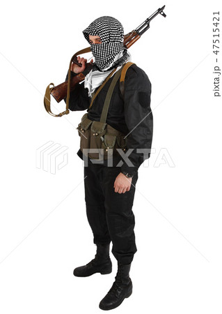 insurgent dressed in black uniform and black and white shemagh with AK 47 rifle insurgent dressed in black uniform and black and white shemagh with AK 47 rifle 47515421