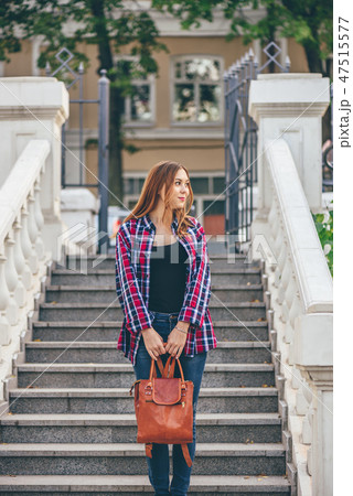 Woman standing on the staircase 47515577