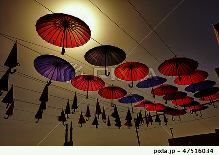 Colorful umbrellas hanging from the sky background 47516034