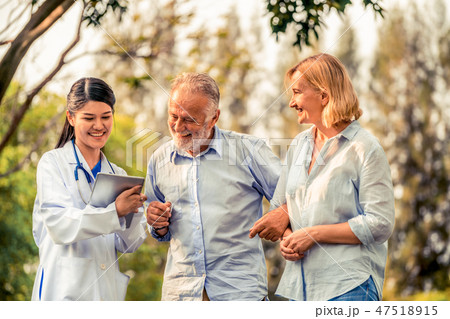 Senior couple talking to nurse or caregiver. Senior couple talking to nurse or caregiver. 47518915