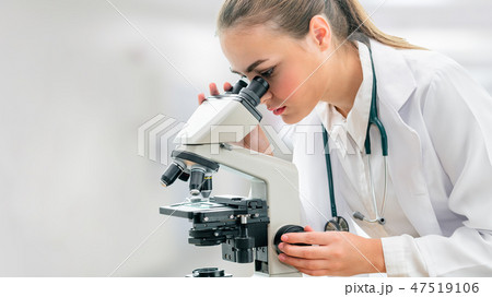 Scientist researcher uses microscope in laboratory 47519106