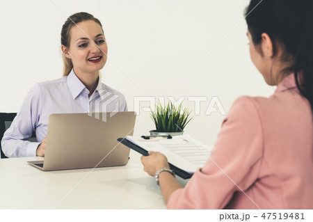 Two young business women meeting for interview. Two young business women meeting for interview. 47519481
