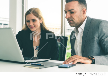 Businessman and businesswoman working in office. Businessman and businesswoman working in office. 47519528