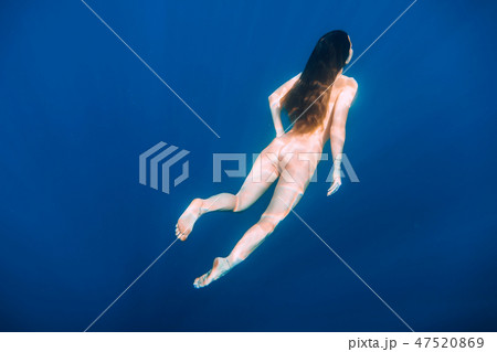 Naked woman swim in sea, underwater in ocean Naked woman swim in sea, underwater in ocean 47520869