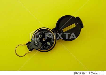 Minimal Compass on bright yellow background Minimal Compass on bright yellow background 47522909