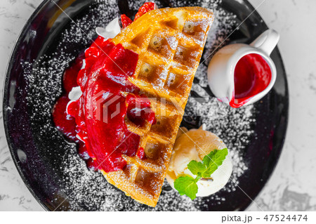 Waffles with strawberry and Vanilla Ice Cream Waffles with strawberry and Vanilla Ice Cream 47524474
