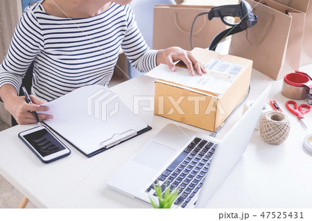 Businessman Shop owner  check Order or list inventory in stock w 47525431