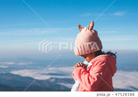 child girl making folded hands in prayer 47526588