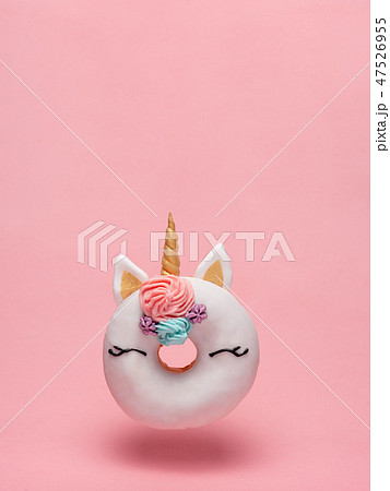 Unicorn donut flying, pink background, copy space 47526955