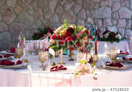 table decorated with fresh flowers and candles for a wedding dinner table decorated with fresh flowers and candles for a wedding dinner 47528020