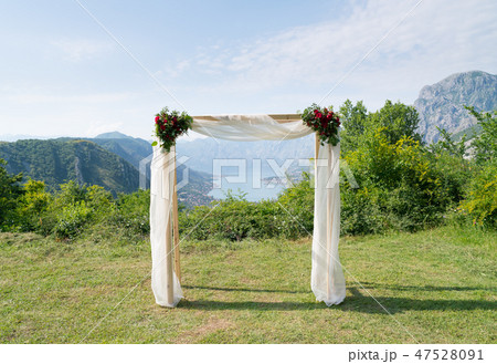 rectangular wedding arch decorated with flowers for the wedding ceremony 47528091