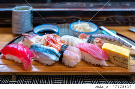 Sushi set on wooded plate in Japanese seafood  47528314