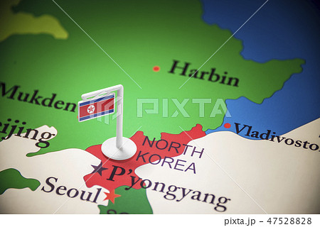 North Korea marked with a flag on the map 47528828