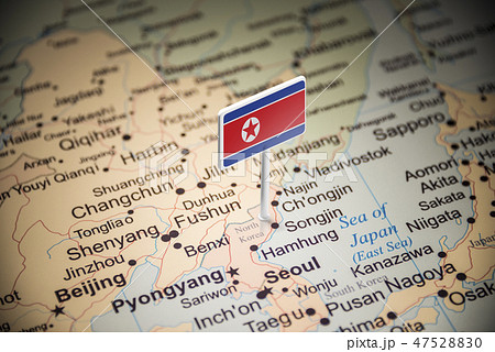North Korea marked with a flag on the map 47528830