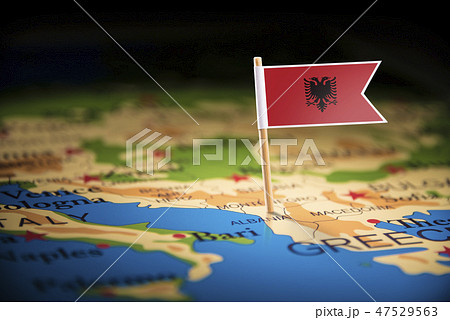 Albania marked with a flag on the map 47529563