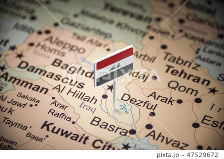 Iraqi marked with a flag on the map 47529672