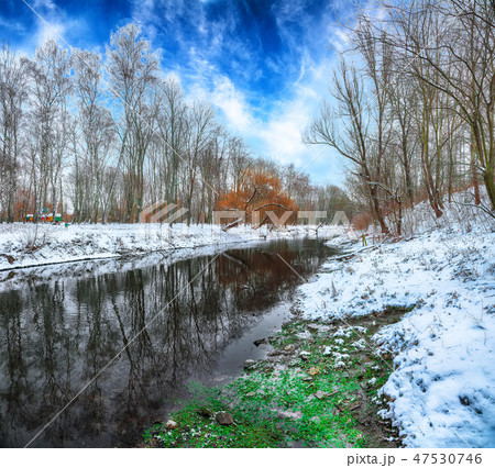 Scenic view of the river and trees in winter Scenic view of the river and trees in winter 47530746
