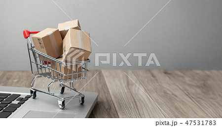 Delivery of the order from the online store. Online shopping. Boxes with goods in the shopping Delivery of the order from the online store. Online shopping. Boxes with goods in the shopping 47531783