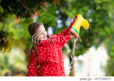 Kid with rain boots. Waterproof wear for children. Kid with rain boots. Waterproof wear for children. 47536655