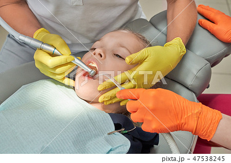 Little girl treating teeth in dentistry clinic. 47538245