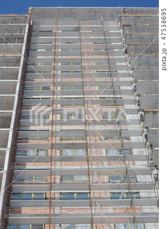 Building construction site with scaffolding 47538695