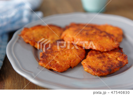 Carrot fritters on a rustic table Carrot fritters on a rustic table 47540830