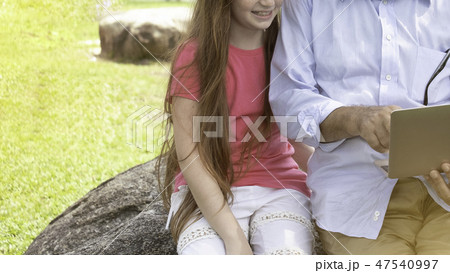 Grandpa or grandfather play or teach running with  47540997