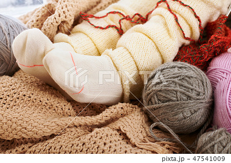 Child legs in warm socks are on a window sill 47541009