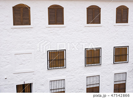 The wall with windows of the building The wall with windows of the building 47542866