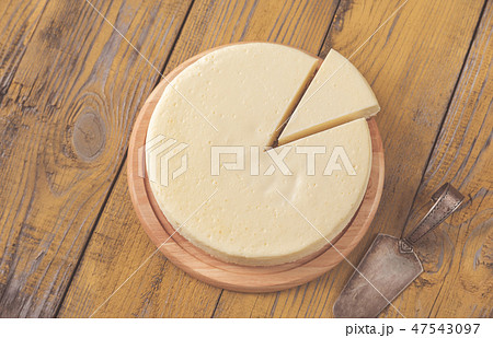 Traditional cheesecake on the wooden table Traditional cheesecake on the wooden table 47543097