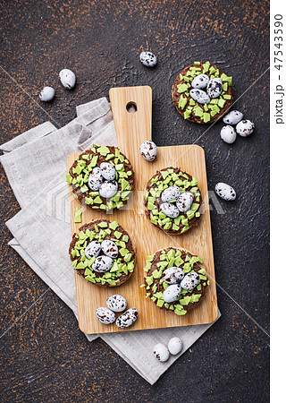Easter cookies in shape of nest with eggs Easter cookies in shape of nest with eggs 47543590